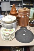 A selection of kitchenalia including a cast iron 15inch bakestone, a salt glazed bread crock with