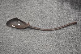 A large African ethnic carved spoon or ladle, measuring 85cm long