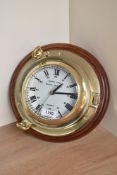 A Rickmer Rickmers Quartz Ships Time brass Porthole Ships clock with roman numeral and 13-00 dial,