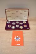 A cased set of Limited Edition London Fire Brigade Historic Badges, 10 in the set, with booklet, Set