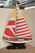 A wooden model Sail Boat, on fitted stand, length 60cm, height 90cm