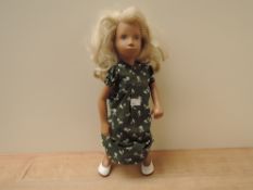 A 1960's/1970's Original Sasha Doll having jointed body, painted blue eyes and blonde hair,