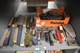 A shelf of 00 gauge including Tri-ang BR 0-6-0 Tank Engine, Observation Coaches, Ambulance Car,