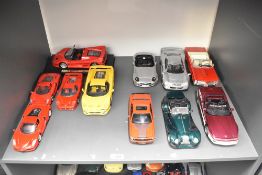 Eleven Maisto 1:18 & 1:24 scale Die-casts including Ferrari's, one on stand, Corvette, Mercedes