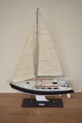 A wooden model Sail Boat, on fitted stand, length 45cm, height 65cm