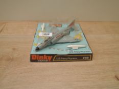A Dinky die-cast, 730 US Navy Phantom, both missiles present, on original card stand with plastic