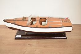 A wooden model Speed Boat with Union Jack Flag, on fitted stand, length 49cm