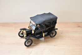 A Franklin Mint 1:16 scale Die-cast, 1913 Model T with label attached
