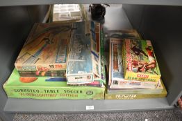 A shelf of Vintage Games comprising: Subbuteo Floodlighting Edition part set, Scalextric