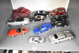 Twelve mixed scale Die-cast and plastic Models including Chevrolet Corvette, Maserati, Aston
