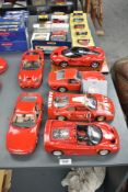 Six Burago 1:18 scale Ferrari Die-casts, F50 (1995), F40 (1987), GTO (1962), 456GT (1992) on display