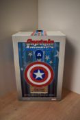 A Sideshow Collectables 1:4 scale metal reproduction Marvel Captain America's Shield and Helmet set,