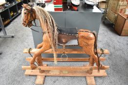 A modern wooden Rocking Horse made by Phil Hill, Birmingham having horse hair mane and tail, leather