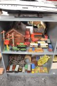 Two shelves of Hornby 0 Gauge including 0-4-0 BR clockwork Loco & Tender 45746, 0-4-0 clockwork Loco