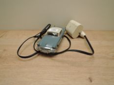 A AMT Inc Birmingham, Mich, tin plate and plastic Studebaker Commander Remote Control Car, blue