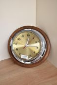 A Weimar, Quartz chrome bulkhead clock with numbered dial, chrome hands and red seconds hand,