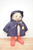 A Gabrielle Bears Paddington Bear having plastic eyes, nose and mouth, wearing red jacket and blue