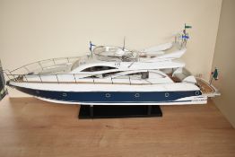 A wooden and plastic scale model, Sunseeker Italian Cabin Cruiser, on fitted stand, length 87cm