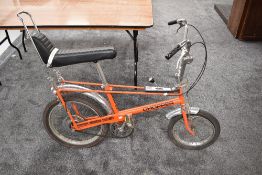 A Raleigh Chopper Bike in orange and chrome with black seat, AWT 3 Speed, Sturmy Archer England,