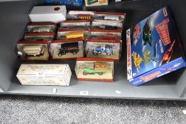 A shelf of Matchbox Die-casts, TB700 Thunderbird Rescue Pack, Gold State Coach and 13 Models of
