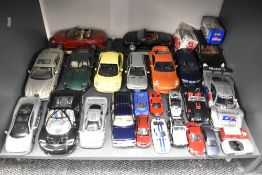Twenty Seven Maisto mixed scale Die-casts including 1:18 on stands, Racing Cars, Soft Tops, Modern