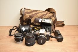 A Nikon FG camera with Nikon Series E 1:1,8 50mm lens, a Tamron Adaptall2 1:2,5 28mm lens, a Nikon