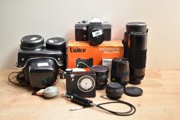 A Praktica LTL3 camera with Pentacon auto 1:1,8 50mm lens, Chinon 1:5,6 300mm lens, Chinon 1:2,8