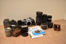 A Pentax MEF camera body with a Kiron 28-210mm 1:3,8-5,6 macro lens, a Miranda 70-210mm 1:4,5-5,6