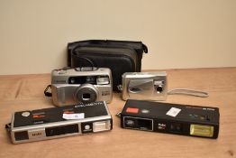 A selection of cameras. A Minolta Pocket Autopak 460TX, a Boots Pocket 110EF, a Pentax ESPIO 838G a