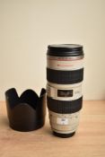 A Canon Zoom Lens EF 70-200mm 1:2,8 with image stabilizer. Is soft carry case