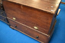 A stained/scumbled pine mule chest having drawer base, dimensions approx W104 D55 H89cm