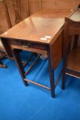 An early 20th Century mahogany occasional table with drop flaps and frieze drawer, width approx