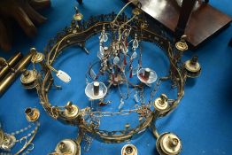 A large brass ceiling light fitting and another ceiling light fitting