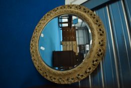 A distressed plaster wall mirror