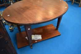 A late 19th or early 20th Century oval windout dining table of oval form on square tapered legs with
