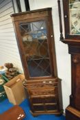 An Old Charm style oak corner display with cupboard under, height approx. 192cm