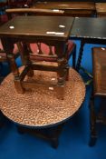 A traditional copper top coffee table, diameter approx. 60cm and a reproduction coffin stool/