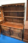 An early 20th Century oak dresser, approx dimensions. W138 D50 H186cm (overall)