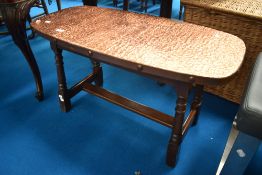 A traditional copper top coffee table , approx 91 x 45cm