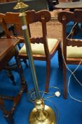 A traditional brass standard lamp