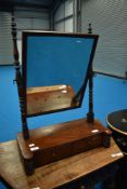 A Victorian mahogany toilet mirror with twin drawers to base