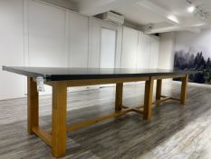 A modern shop display table, slate top (sectional) on golden oak frame, approx 320 x 70cm