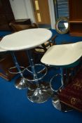 A modern adjustable height circular table and stools, diameter approx. 60cm