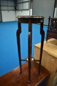 An early 20th Century mahogany plant stand, height approx 92cm, diameter 33cm