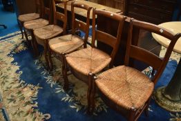 A set of six French rush seated kitchen chairs