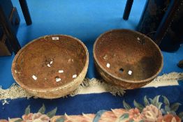 Two cast iron demi-sphere trough style planters