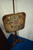 A Victorian mahogany pole screen