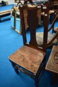 A 19th Century oak solid seat chair having vase back