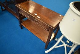 An early 20th Century oak low side table having edge to front and sides, dimensions approx. W75