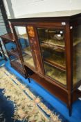 An Art Nouveau mahogany and inlaid display cabinet with shelf under